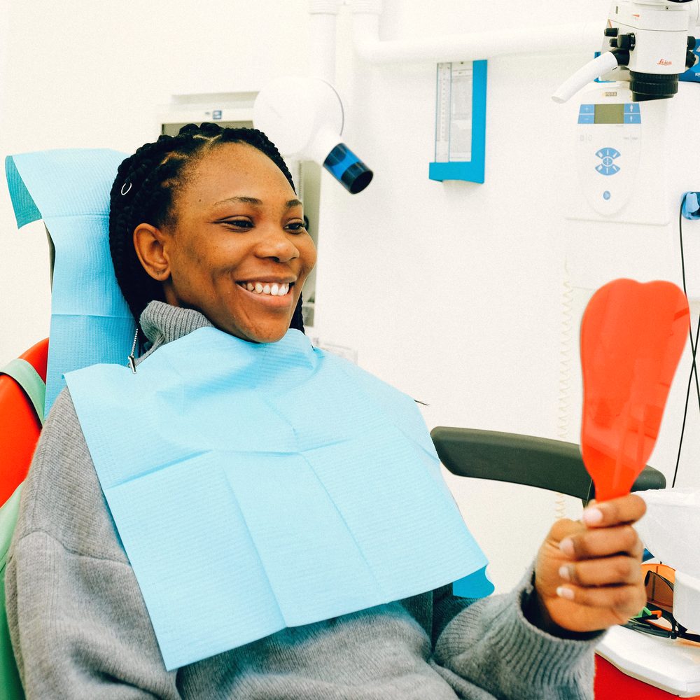Patient smiling during a visit to Kamalaa Dental Clinic
