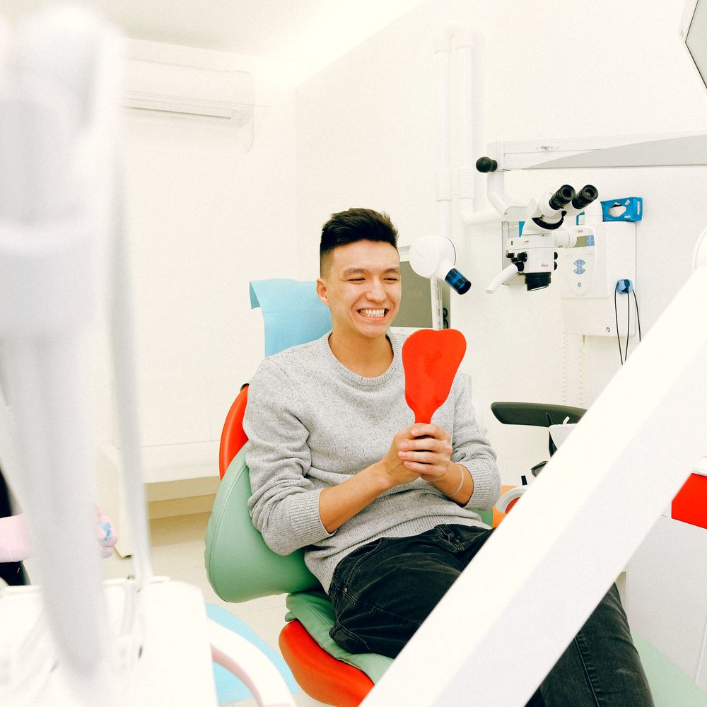 Patient relaxed in the treatment chair at Kamalaa Dental Clinic