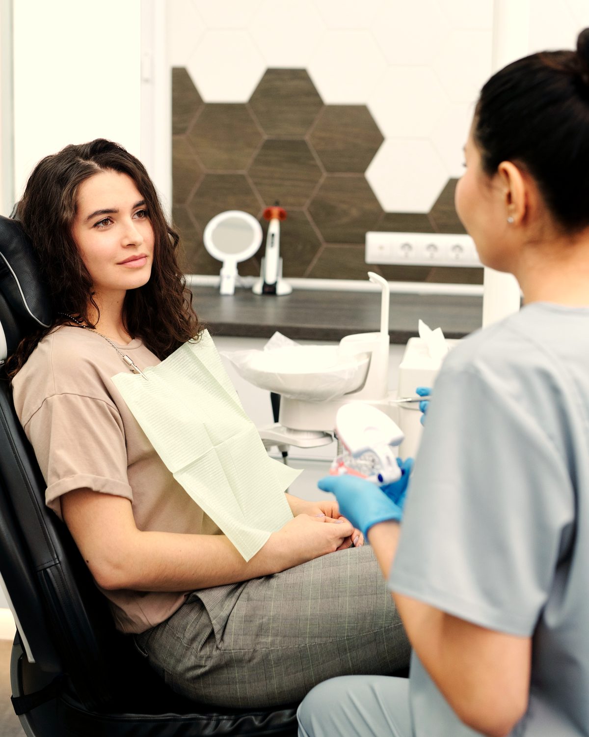 Dentist welcoming a patient for a consultation at Kamalaa Dental Clinic